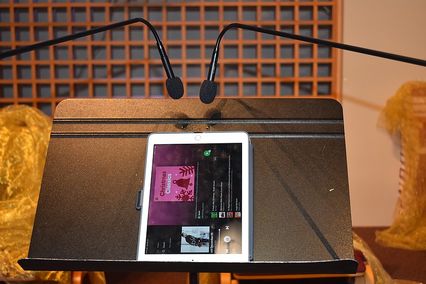 An iPad placed near choir microphones provided the music for the morning. Members were careful not to speak too loudly near the setup.