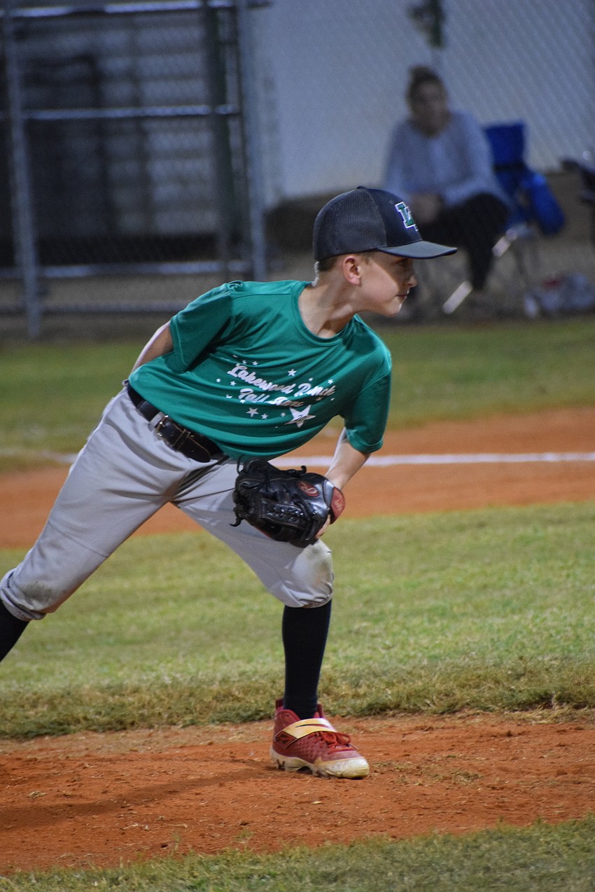 Ethan Snyder gets the catcher's signal before unleashing his pitch.