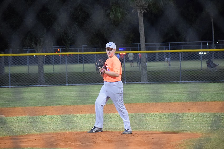 Wesley Anderson goes into the windup before releasing his fastball.