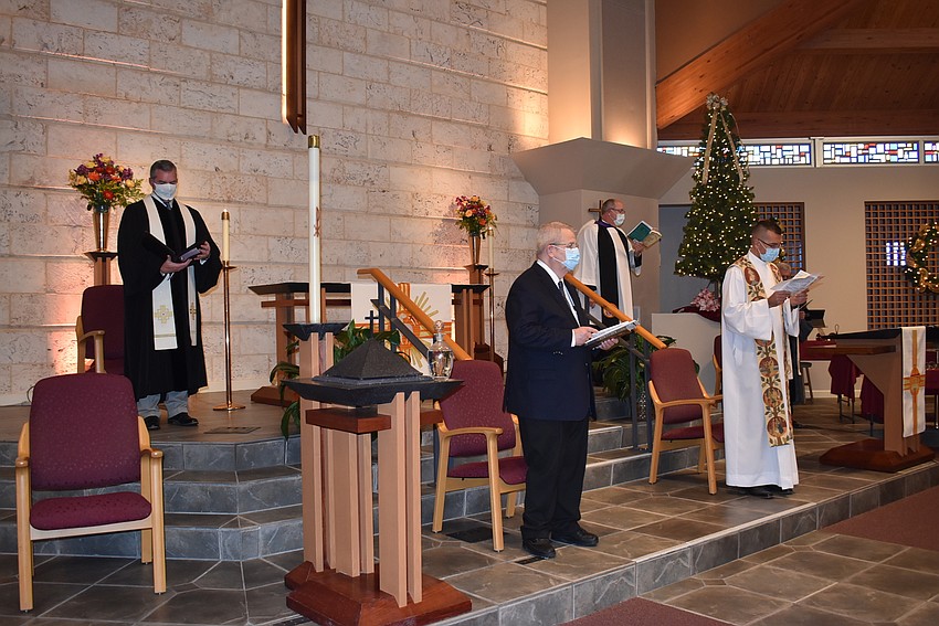 The six faith leaders occupied the front of the room and took turns moving to speak.
