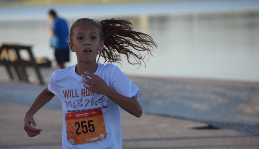 Venice 10-year-old Sydney Johnson finishes in a personal best of 21 minutes for the 5K race.