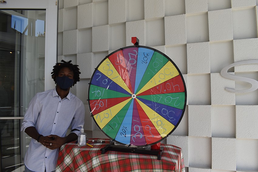 Terrell Cheaves invited Shore shoppers to spin the wheel to win a discount.