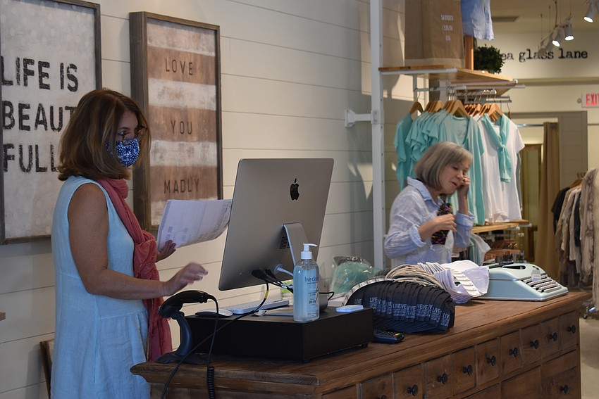 Manon Giguere and Catherine Zagani run the counter at Sea Glass Lane, a clothing boutique that just opened that same day.