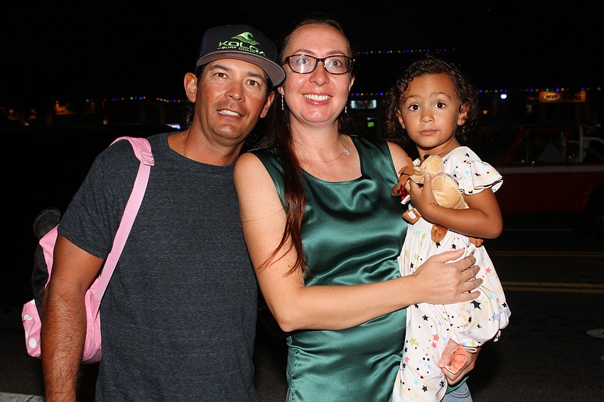 Jason, Larisa and Angelica Hart were in the Christmas mood.