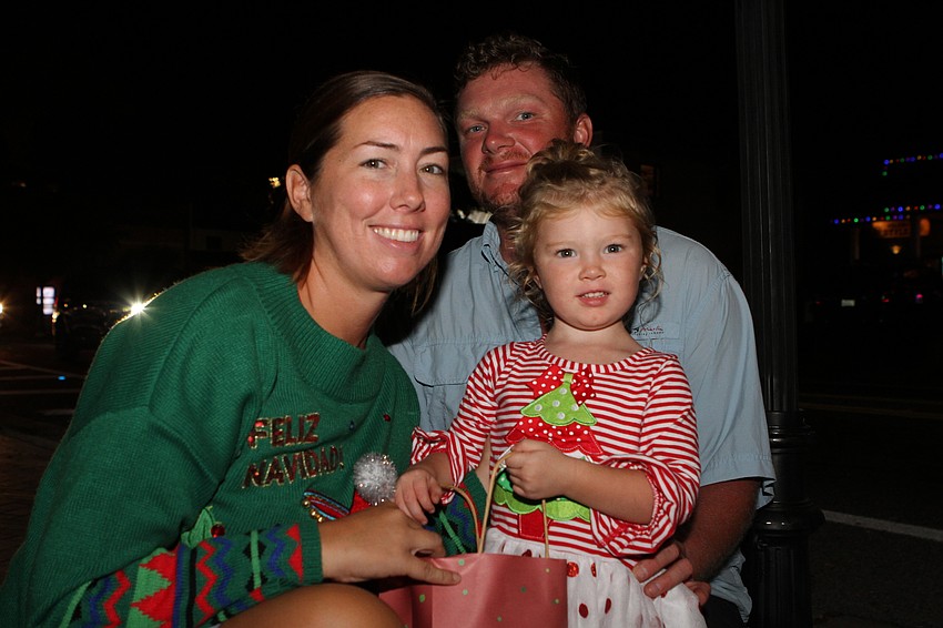 Haley and Billy Carter crouched down with Felicity Carter.