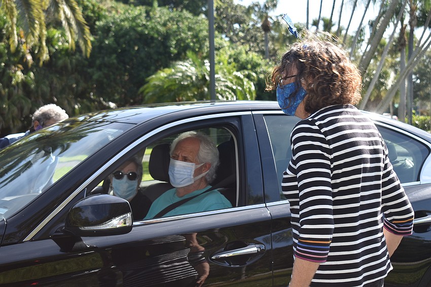 Irwin Pastor says hello to Karen Gary.