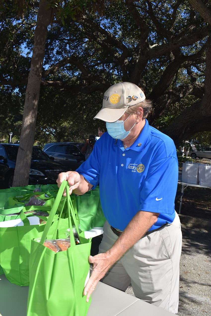 Jack Rozance organizes the bundles for each family.