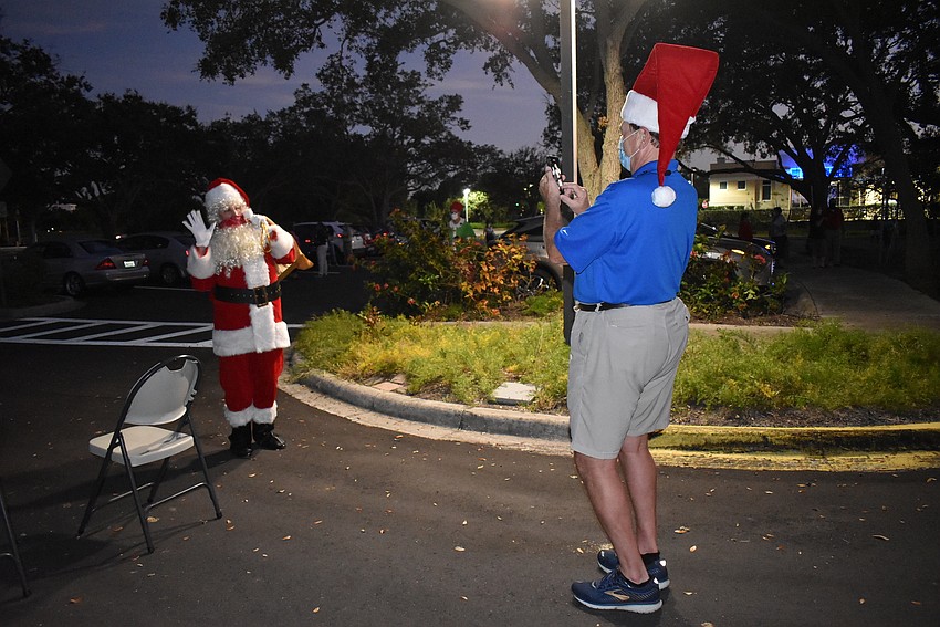Nancy Rozance poses while Jack Rozance snaps a photo.