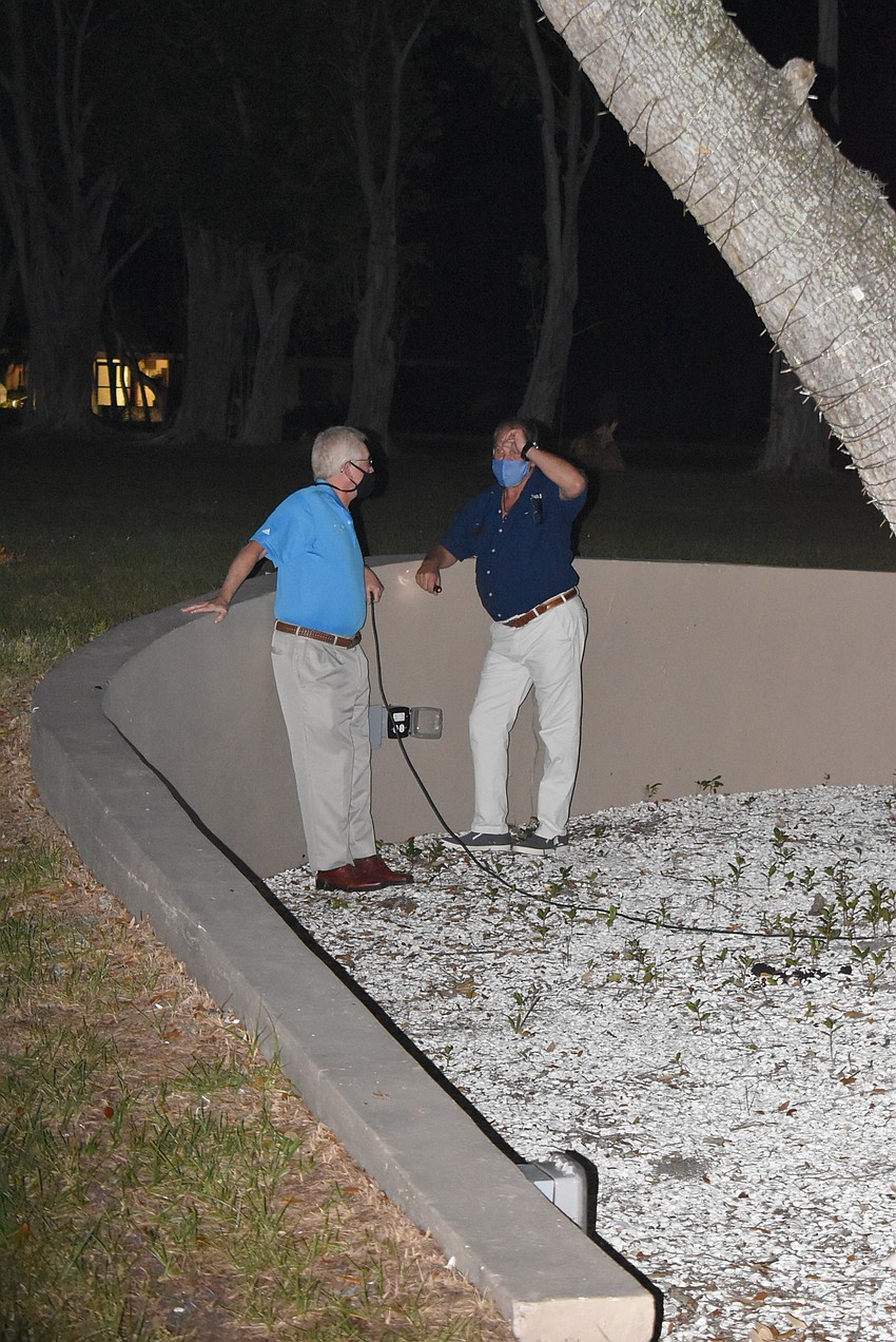 Mayor Ken Schneier and Mark Meador prepare to light the tree.