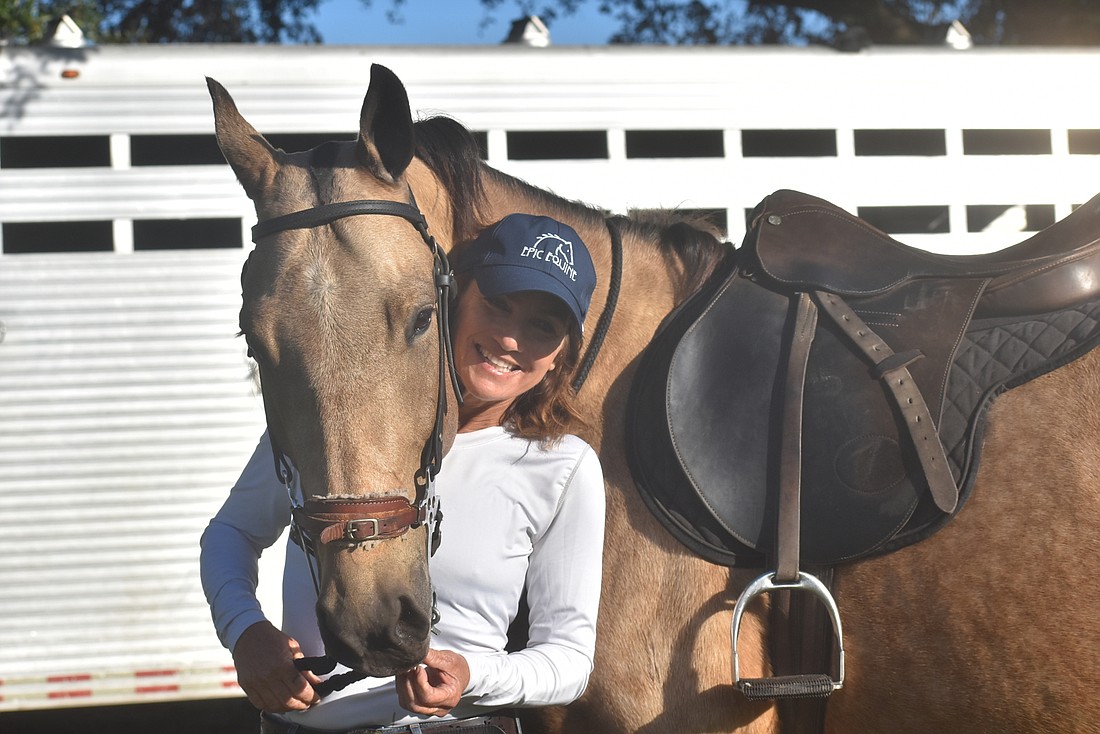 Jaymie Klauber and 4-year-old CC. CC is one of 12 horses Klauber owns in Sarasota.
