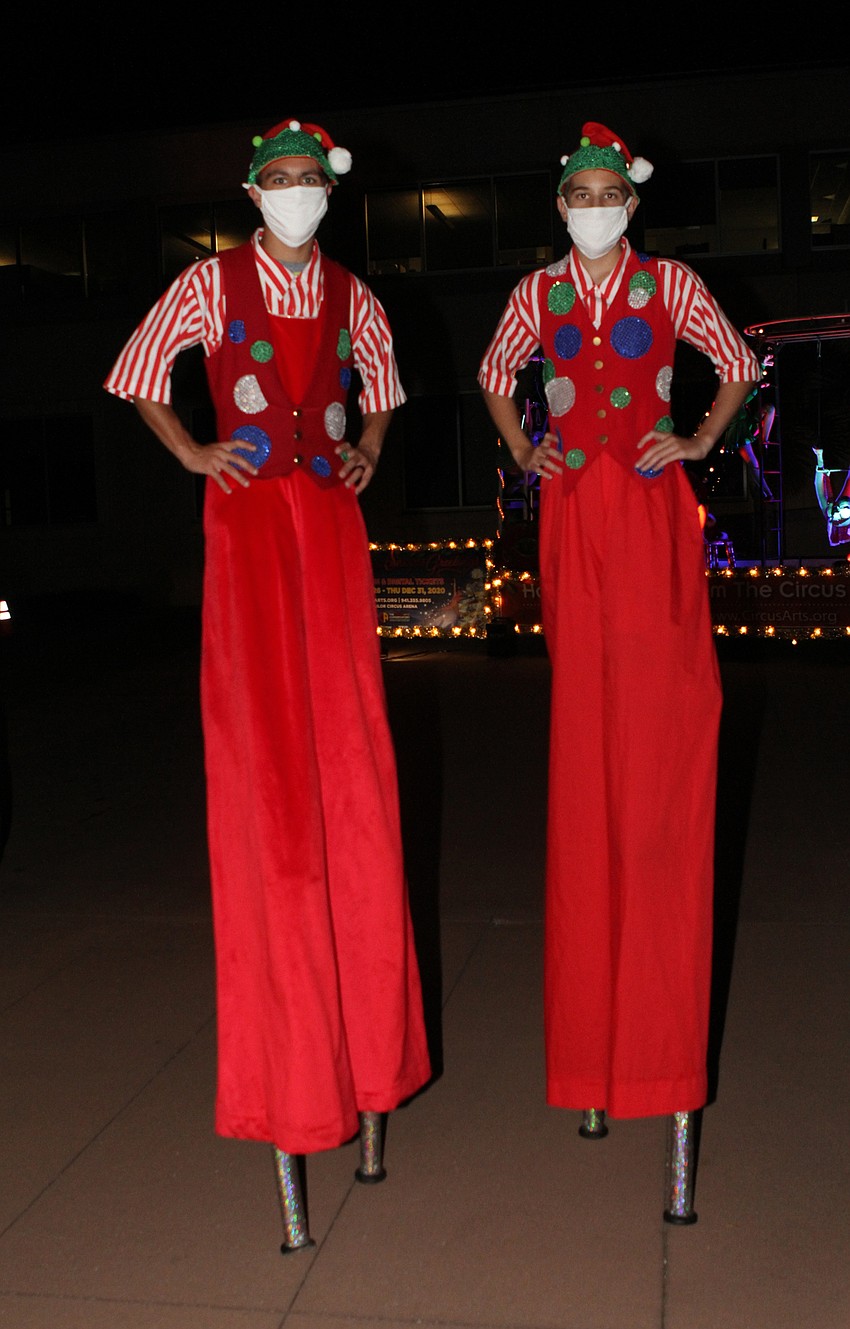 Vayna Passanita and Caleb Overholt towered over the cruising cars.