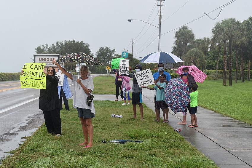 June 11: A small band of protesters made their voices heard along Gulf of Mexico Drive.