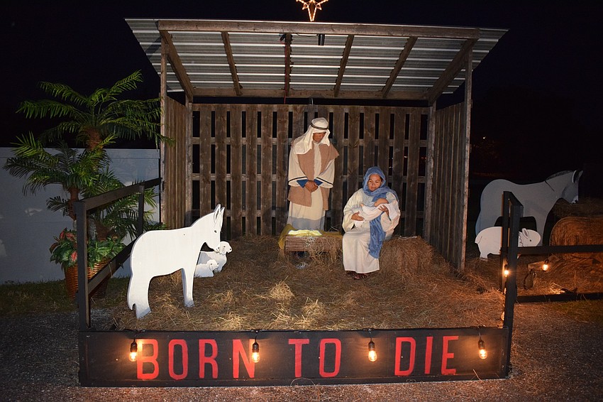 Sonia Mendoza and her husband, Jesus Mendoza, portray Mary and Joseph during the drive-thru Bethlehem. The couple has been participating for at least four years with their children, Jesus Mendoza Jr., 13, and Grace Mendoza, 11.