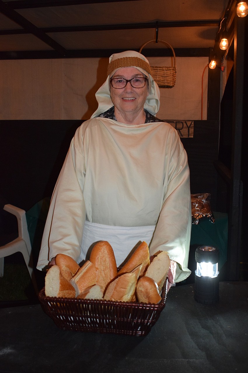 Sonda Tioitty prepares baked goods for the bakery. She had pre-packaged cookies available to pass out to visitors.