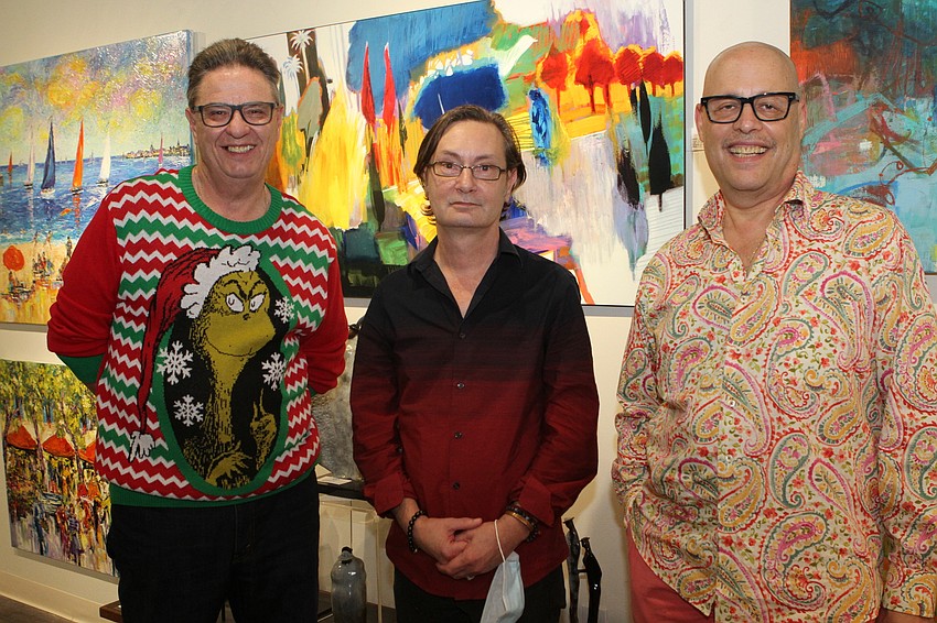 Rich Puckett dressed festively with owners Marc Cates and Andrew Chasen at Chasen Galleries.