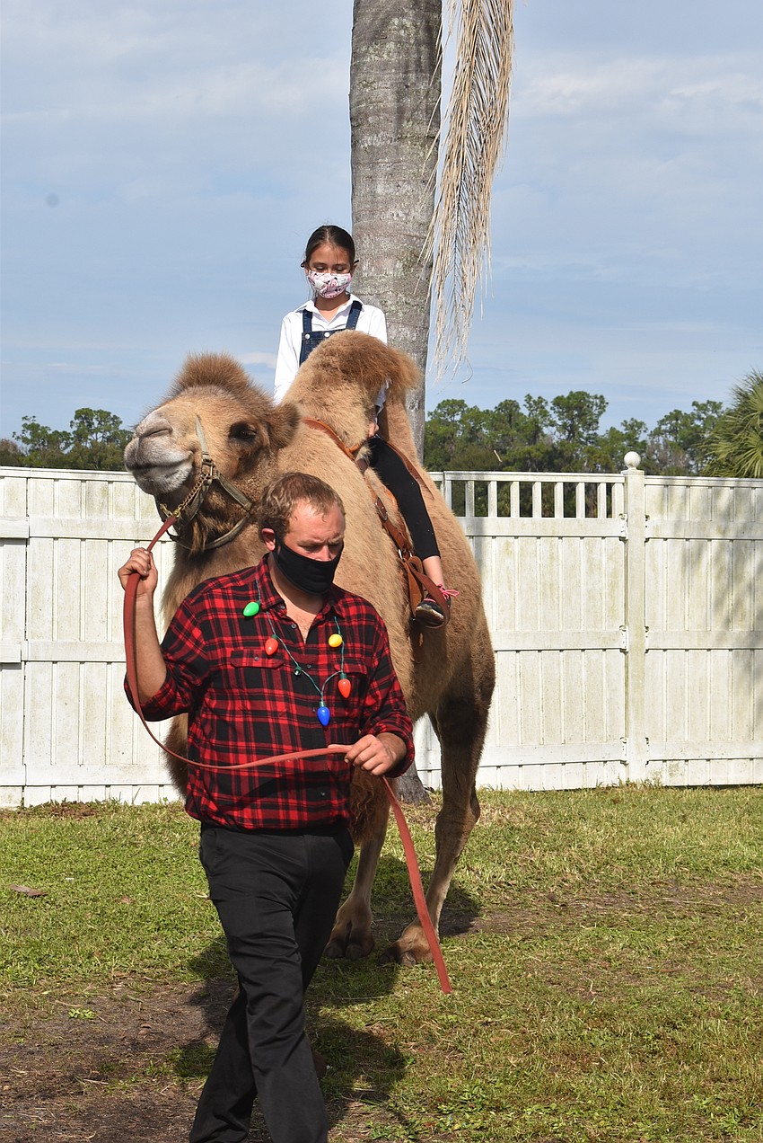 Oona Olmstead of Bayshore Gardens said she loves giraffes but also got to ride a camel.