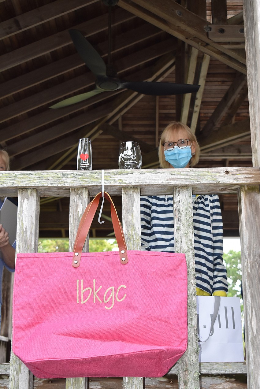 Linda Ulrich waves from the pavilion.