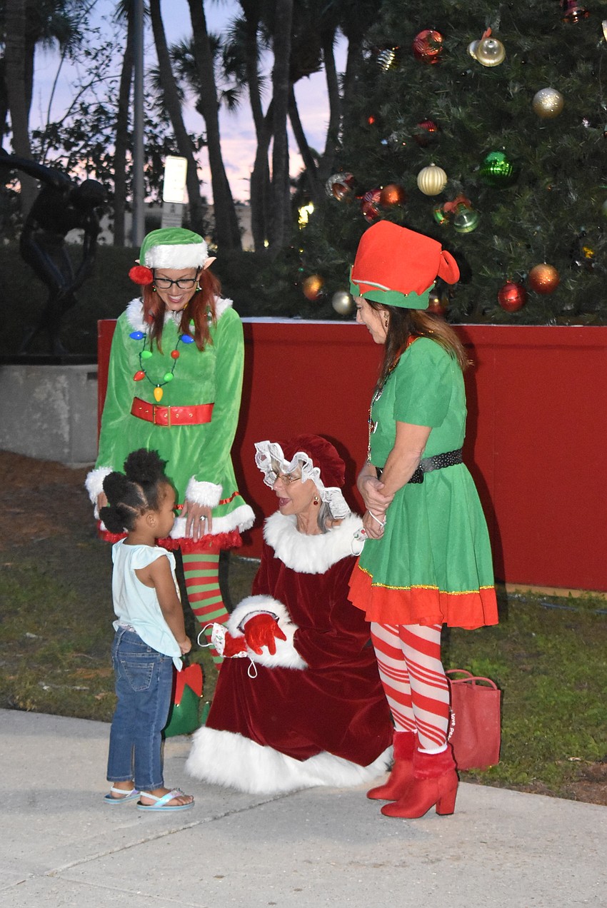 Ramiyah Henderson says hello to Mrs. Claus.