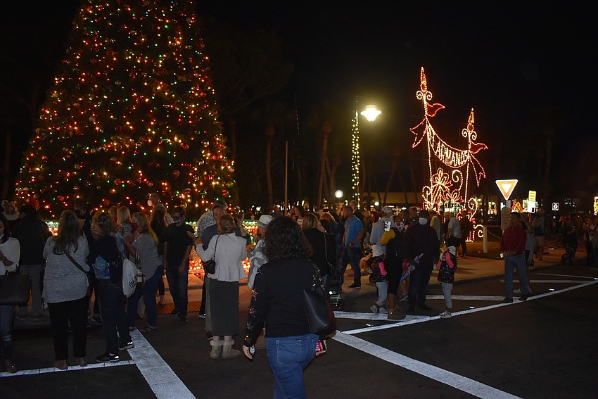 Families flock to the tree to take pictures.