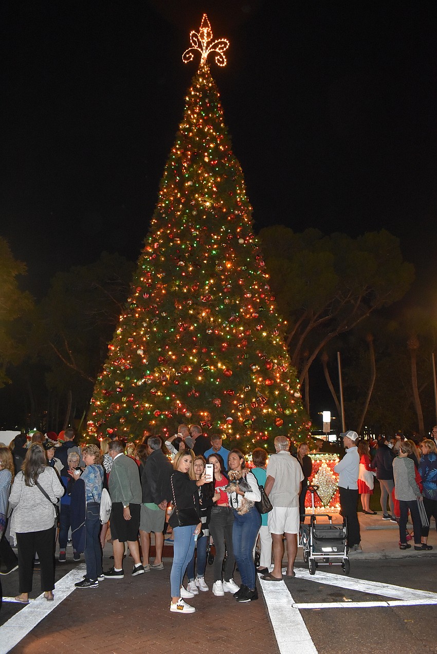 Family pictures were taken in front of the tree, but accidental photo-bombs abounded.