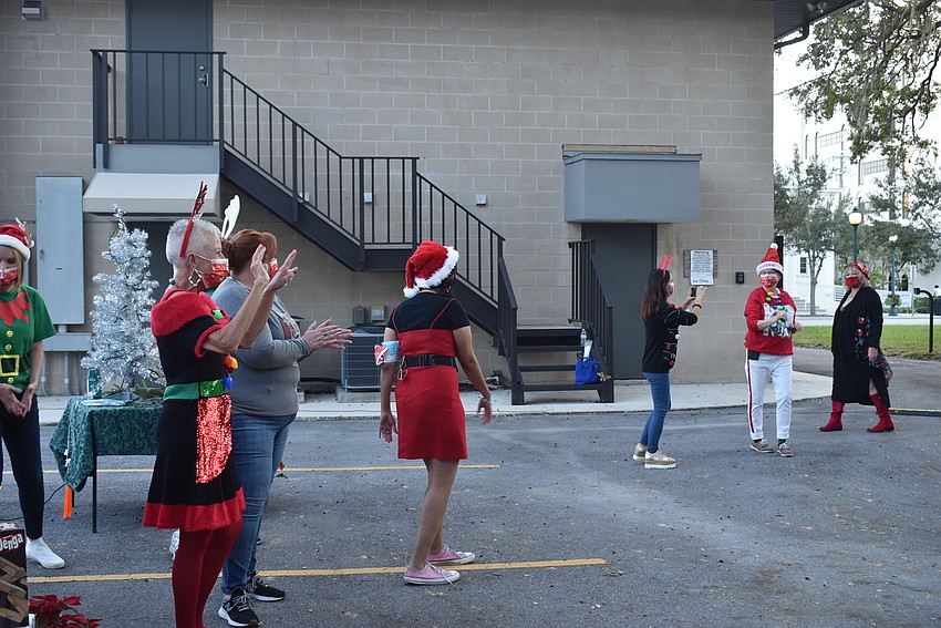 Each car was greeted with enthusiastic cheers and a ringing cowbell.
