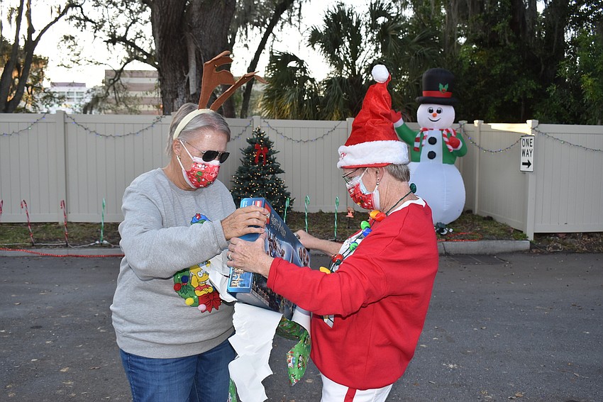 Maggie Shaw and Andrea Andrus had to unwrap a present that was delivered.