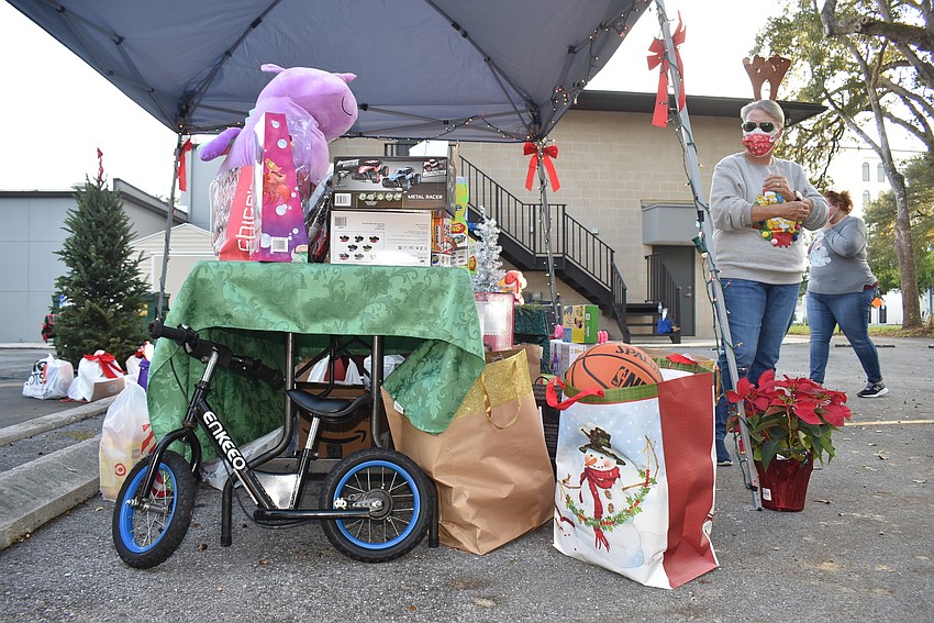 Andrea Andrus surveys the gifts.
