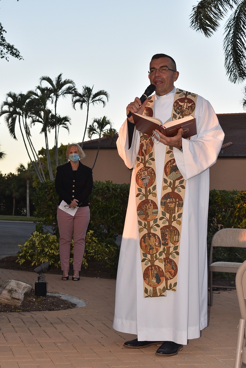 Father Robert Dziedziak thanked everyone for coming, saying he was cold even under his robes.
