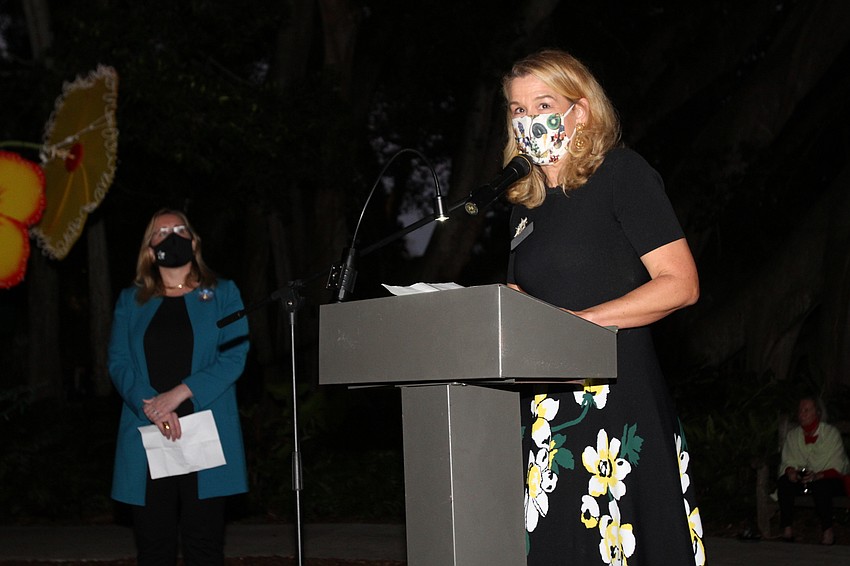 Board chair Pauline Wamsler thanks the audience for safely assembling at the gardens.