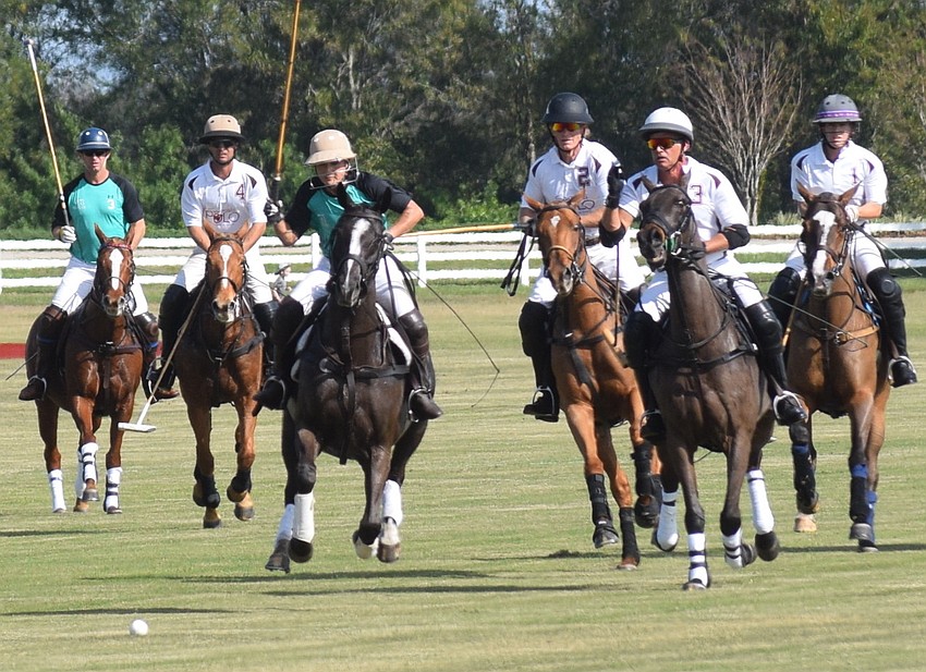 Epic Equine's Jaymie Klauber charges in front of the entire Rawhide Creek team in the first chukkar.