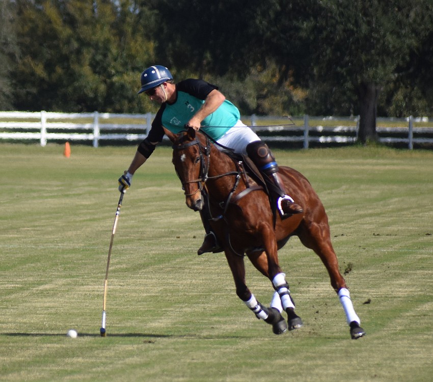 Epic Equine's Francisco Llosa reaches for a shot in the season opener.
