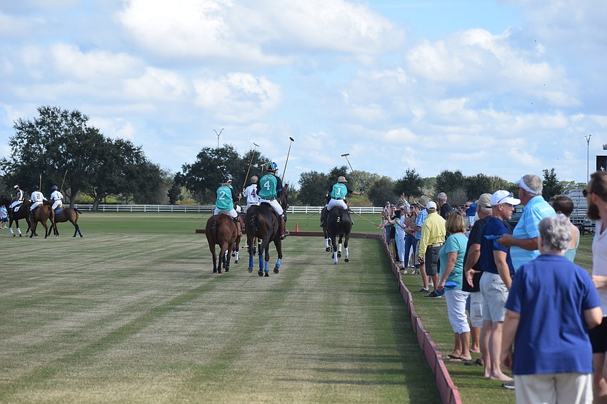 The players didn't deliver the usual high fives to fans before the match to stay socially distanced.