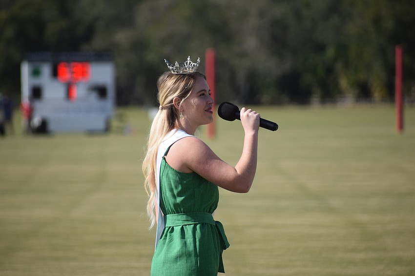 Sarasota's Mary Kathryn France, the Miss Orlando Outstanding Teen, sings the National Anthem before the season-opening game.