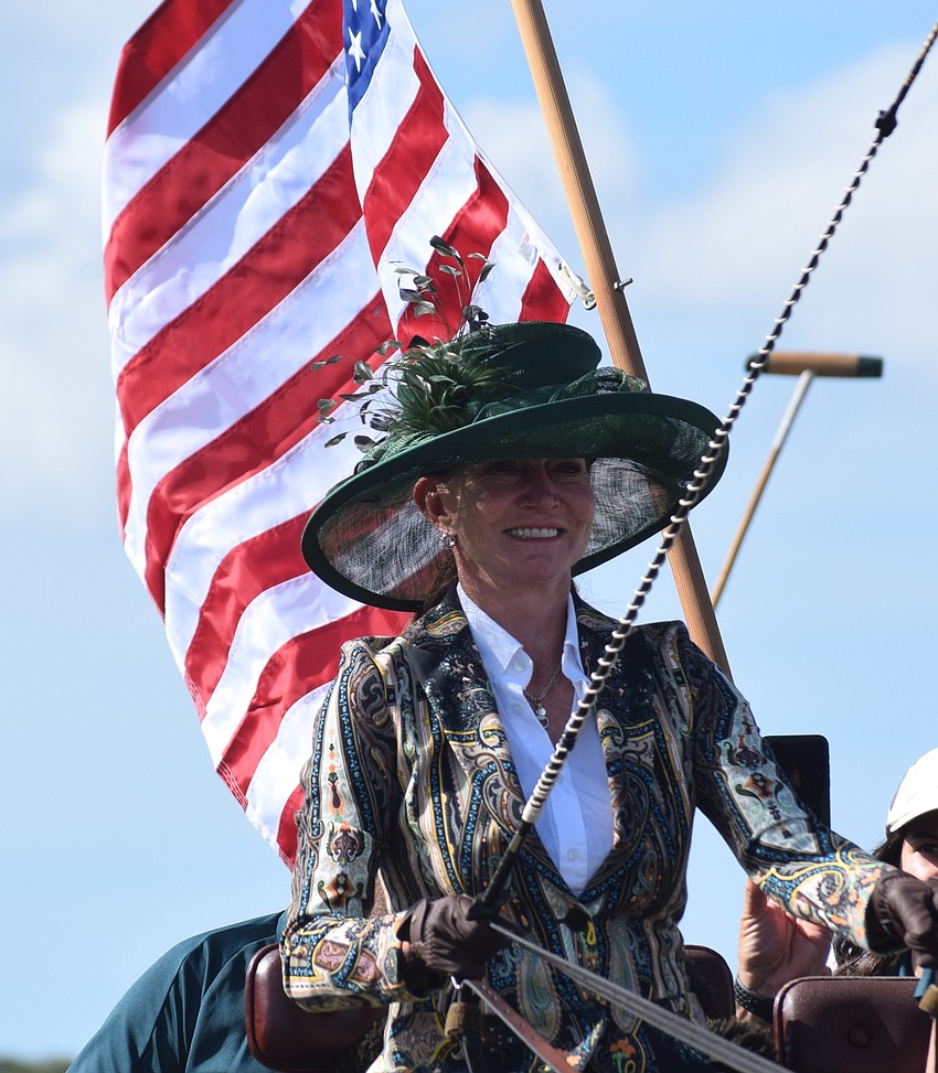 Misdee Miller continues her tradition of presenting the colors on opening day at the Sarasota Polo Club.
