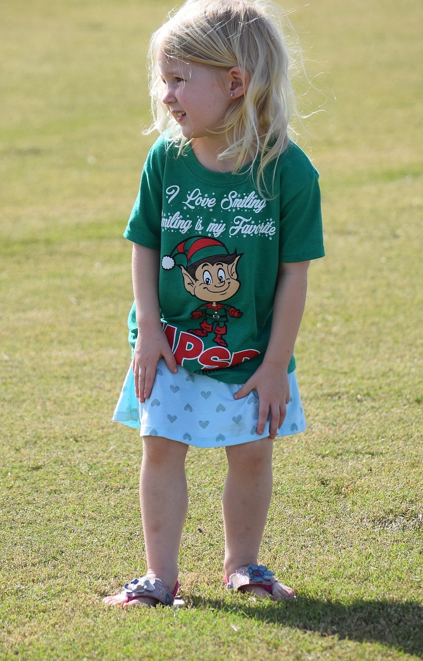 Parrish 4-year-old Charlotte Begley tries divot stomping at halftime.