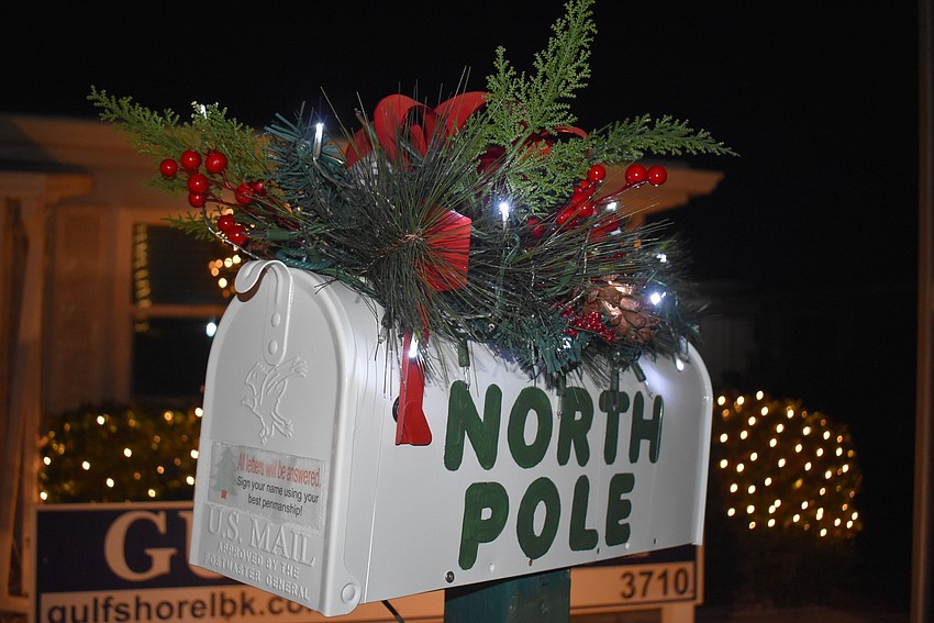 A Santa box stands ready to receive and answer letters from kids.