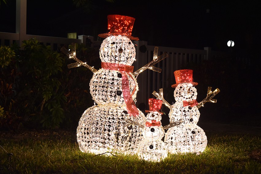 Near the pool, three snowmen made a brave stand in the Florida winter.