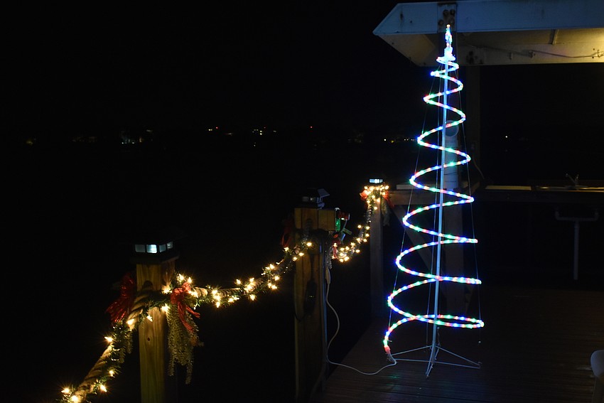 Spiraling, multicolored trees frame the two sides of the dock.