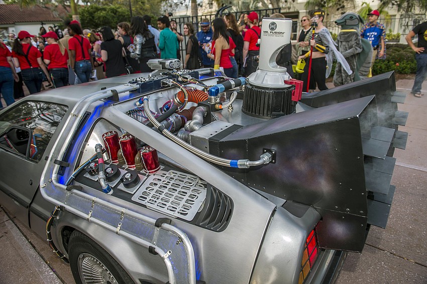 Dr. Larry and Pat Thompson arrive as “Captain Creative and The Imaginator” in a 1982 DeLorean