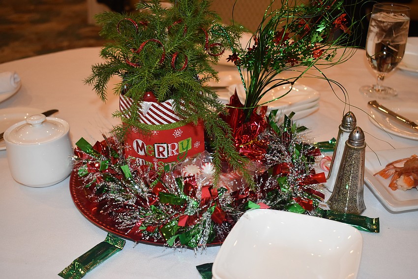 The tables were festooned with merry decor.