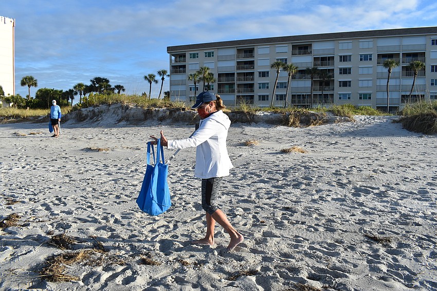 Nancy Rozance's bag grew heavier as she found bigger bits of garbage.