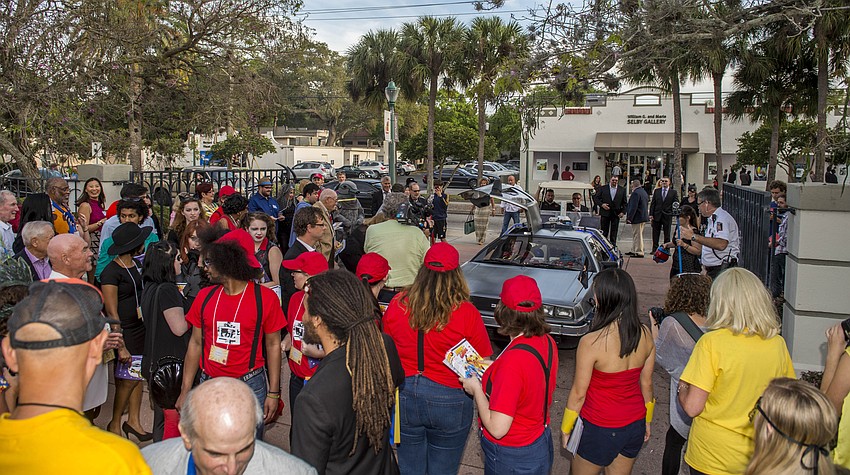 Dr. Larry and Pat Thompson arrive as “Captain Creative and The Imaginator” in a 1982 DeLorean