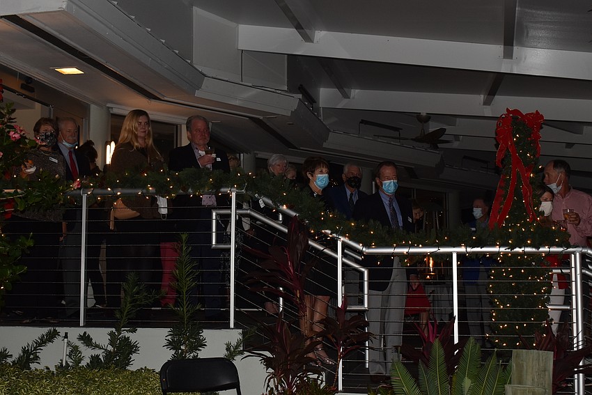 Attendees watched from the stairs.