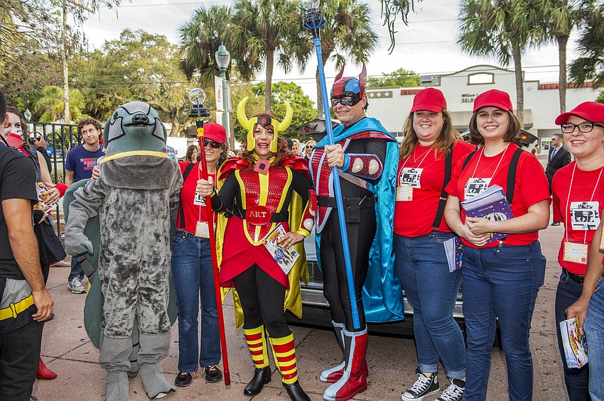 Dr. Larry and Pat Thompson arrive as “Captain Creative and The Imaginator” in a 1982 DeLorean