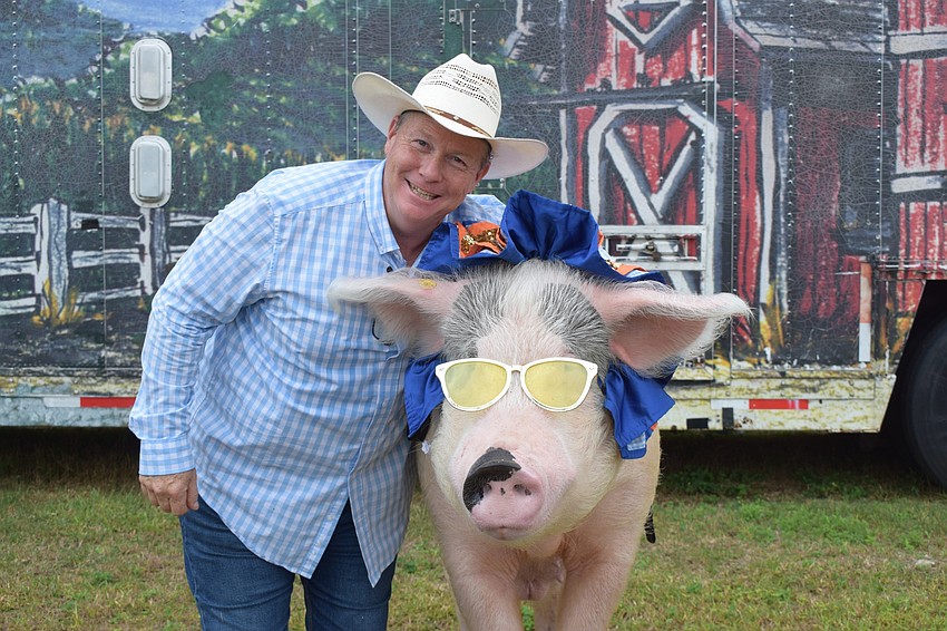 Les Kimes loves working with Mac, a 750-pound pig, during the Pork Chop Revue. Kimes' father, Boyd Kimes, started the show in 1956. Next year, the show will be celebrating its 65th anniversary.