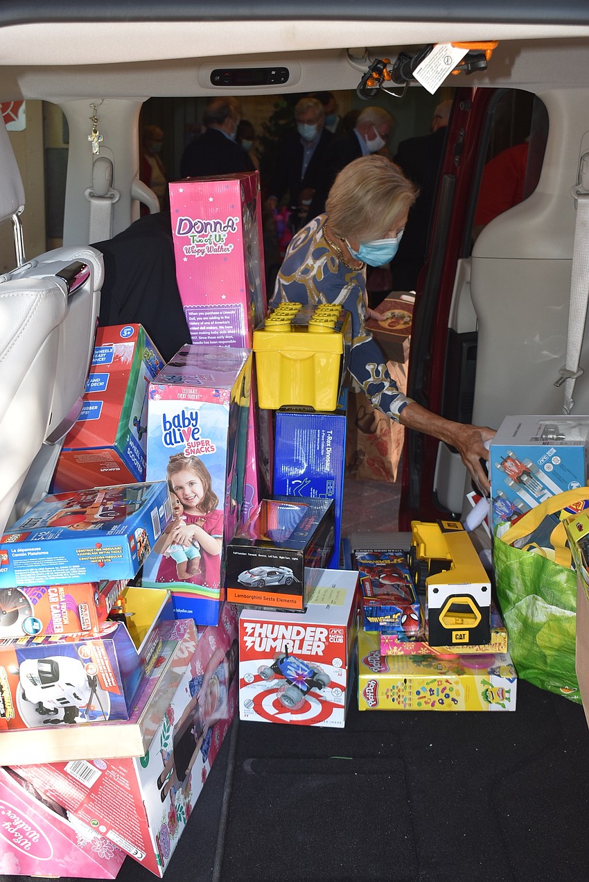 The admission toys were loaded into a car to be donated.