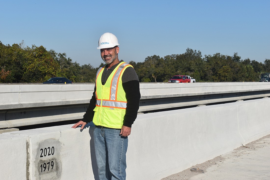 Florida Department of Transportation community outreach manager Brian Bollas stands on a new I-75 bridge over the Braden River. The first bridge was constructed in 1979 when I-75 was extended through Manatee and Sarasota counties.
