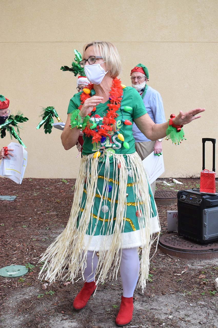 Linda Britt-Smith, the activity coordinator at Cypress Springs Gracious Retirement Living, hula dances to 