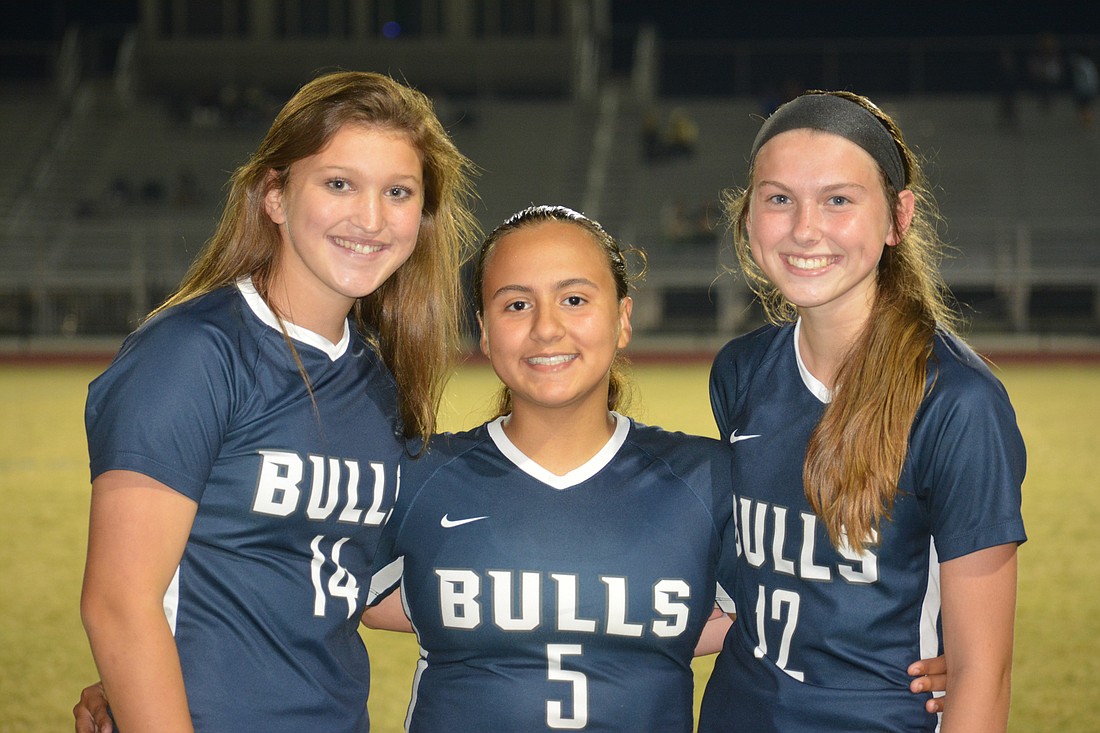 Izzy Silverio, Krystal Parra and Madelyn Portwood, East County residents, are important parts of the Bulls soccer team.
