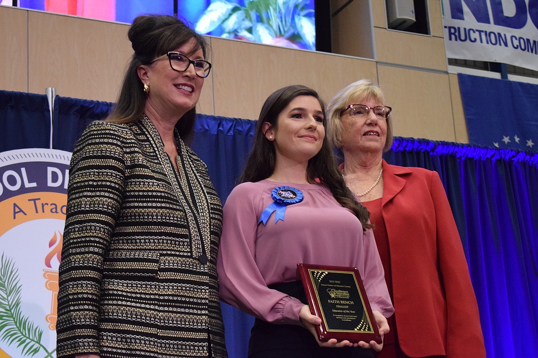 Superintendent Cynthia Saunders, Faith Bench, a math teacher at Braden River Middle School, and Genelle Zoratti Yost, deputy superintendent of instructional services, honor Bench as a finalist for Educator of the Year. File photo.